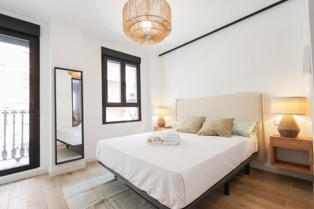 Ένα ή περισσότερα κρεβάτια σε δωμάτιο στο Hostal Roca 26