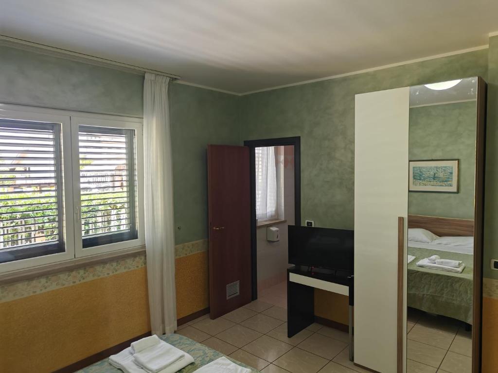 Postel nebo postele na pokoji v ubytování Hotel Roma Sul Mare