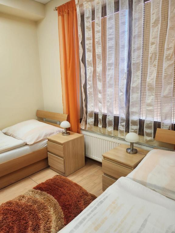 Postel nebo postele na pokoji v ubytování Penzión Daniel