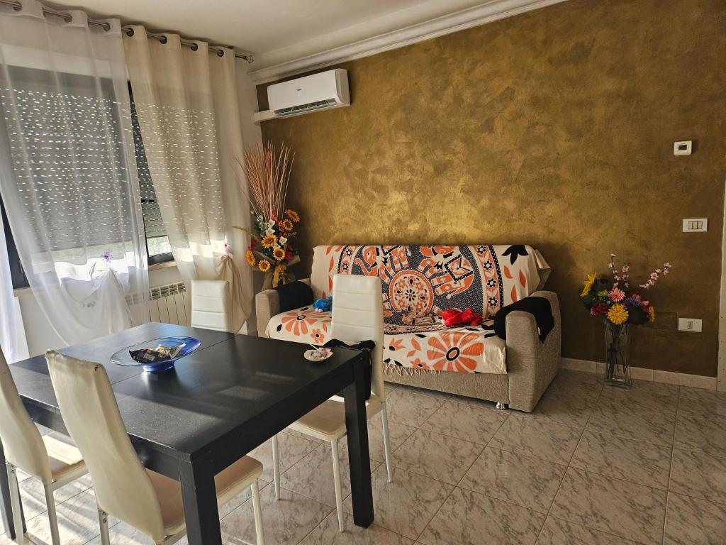 A seating area at Appartamento Divino Tramonto