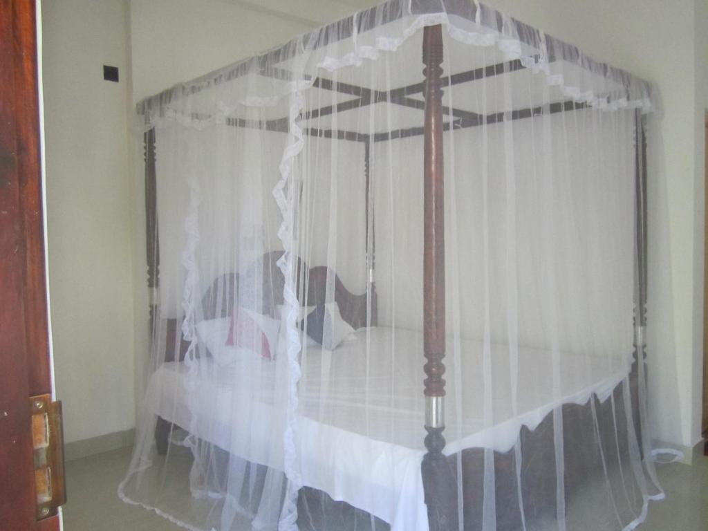 Postel nebo postele na pokoji v ubytování Serene Niche