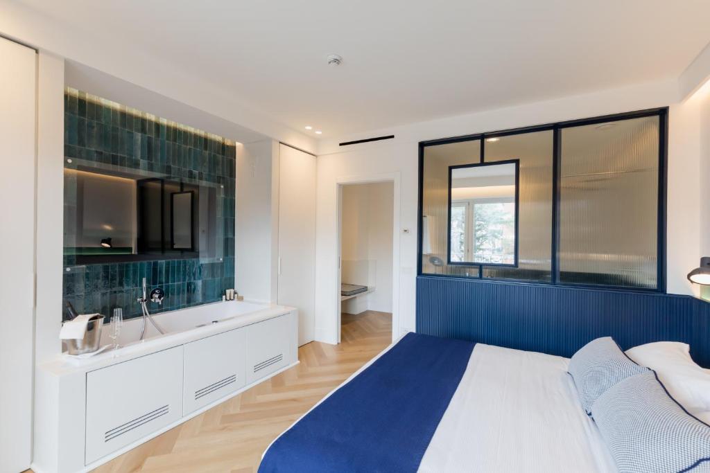 Postel nebo postele na pokoji v ubytování Grand Hotel Cesare Augusto