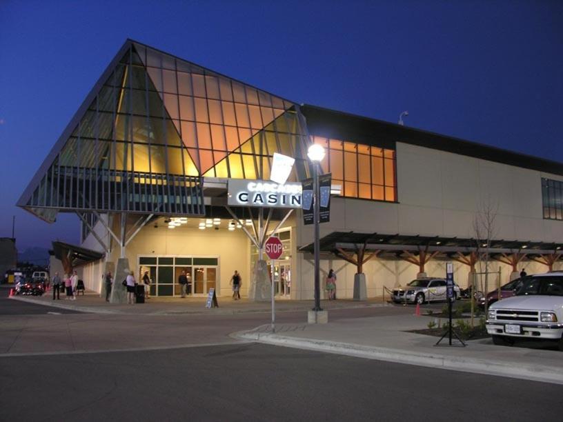 a building with a car parked in front of it at Coast Hotel & Convention Centre in Langley