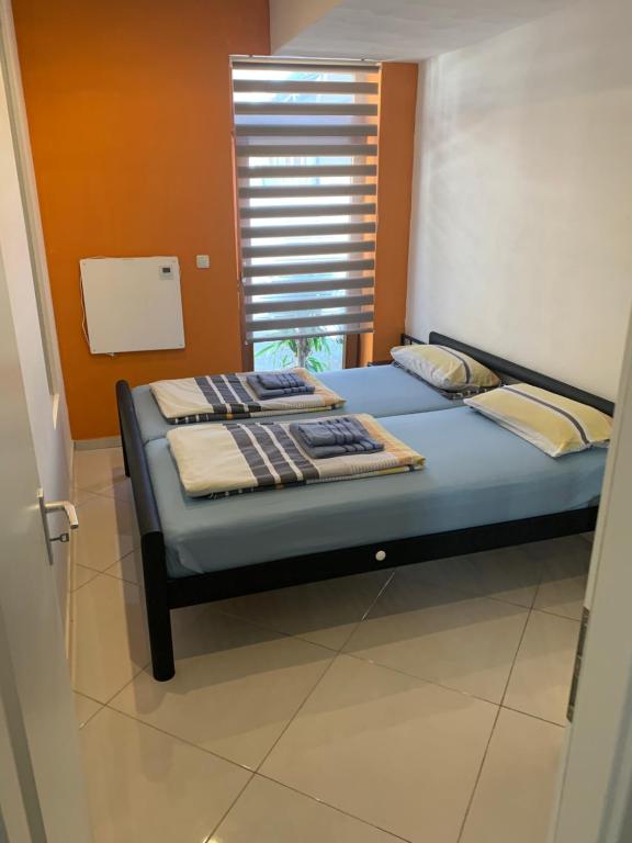 Postel nebo postele na pokoji v ubytování Seven‘S Apartments I