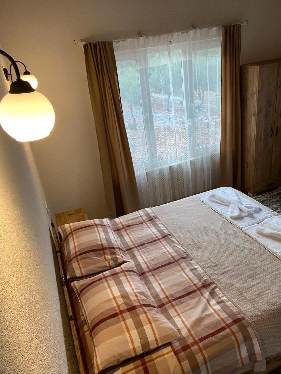 Postel nebo postele na pokoji v ubytování Galabaapart