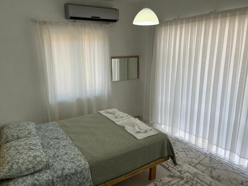 Postel nebo postele na pokoji v ubytování Galabaapart