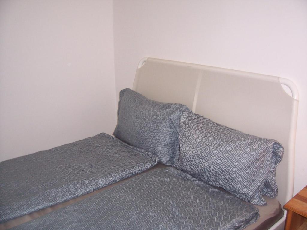 Postel nebo postele na pokoji v ubytování A & E Apartment Budapest