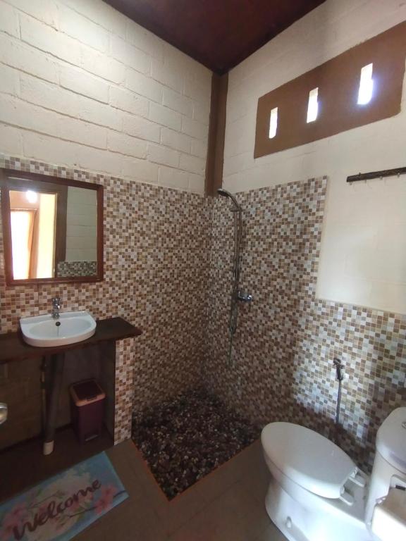 Koupelna v ubytování Nêst Guesthouse Tetebatu