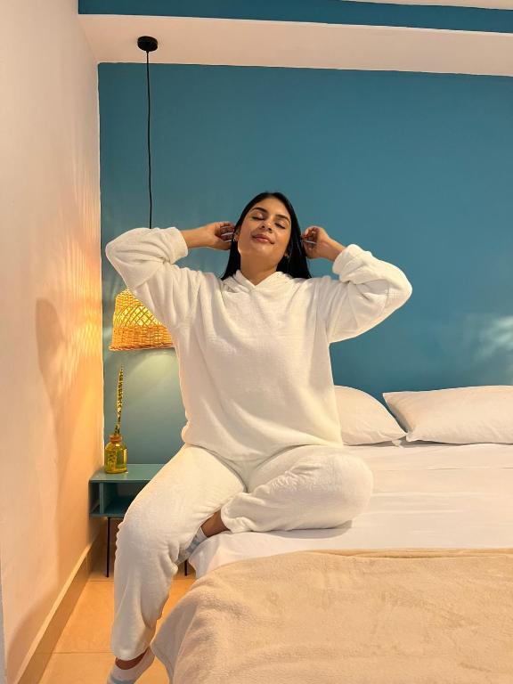 Postel nebo postele na pokoji v ubytování Hotel Neblina Calima
