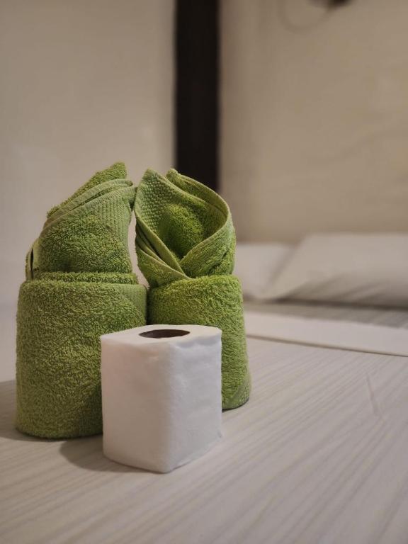 Una cama o camas en una habitación de Siargao Zita's Garden Inn