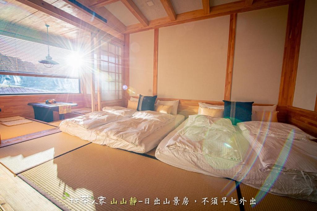 Postel nebo postele na pokoji v ubytování Alishan Hinoki B&B
