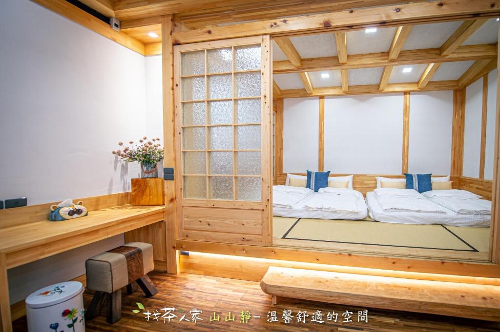 Postel nebo postele na pokoji v ubytování Alishan Hinoki B&B