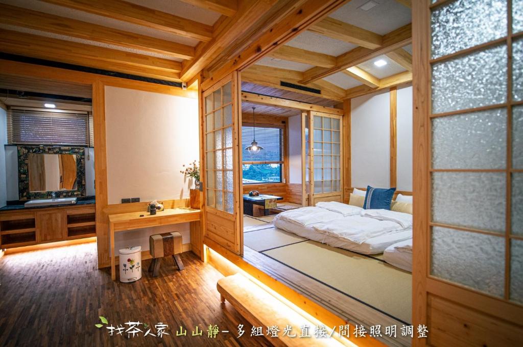 Postel nebo postele na pokoji v ubytování Alishan Hinoki B&B