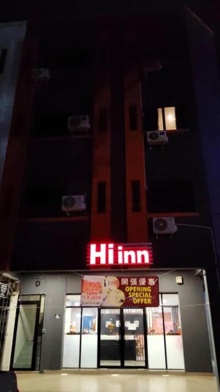 a building with a hilim sign on it at night at Hi-Inn in Miri