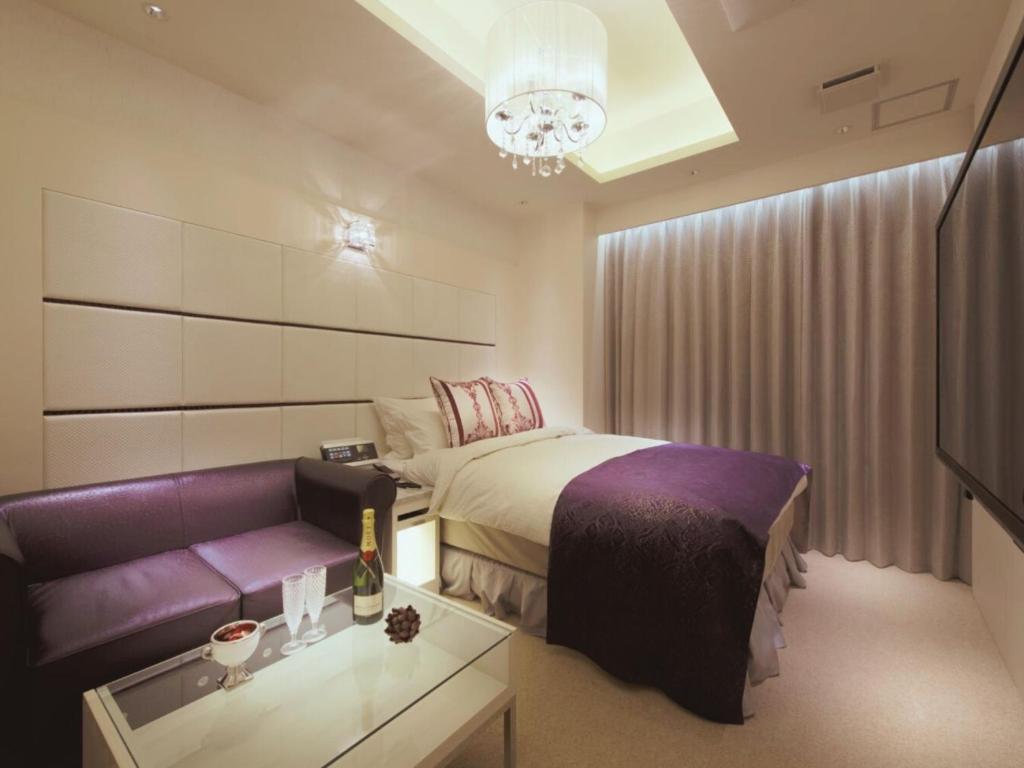 Postel nebo postele na pokoji v ubytování HOTEL GLANZ CASCATA