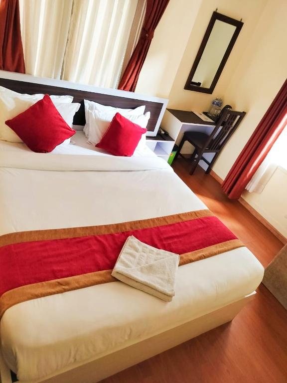 Postel nebo postele na pokoji v ubytování Hotel Odyssey Nepal