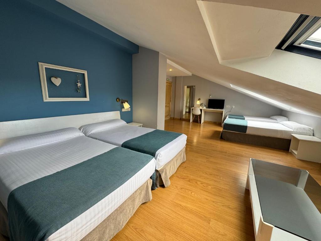 Postel nebo postele na pokoji v ubytování Hotel Jakue