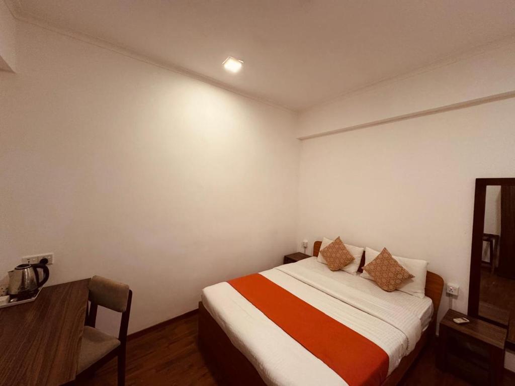 Postel nebo postele na pokoji v ubytování CityRest Fort