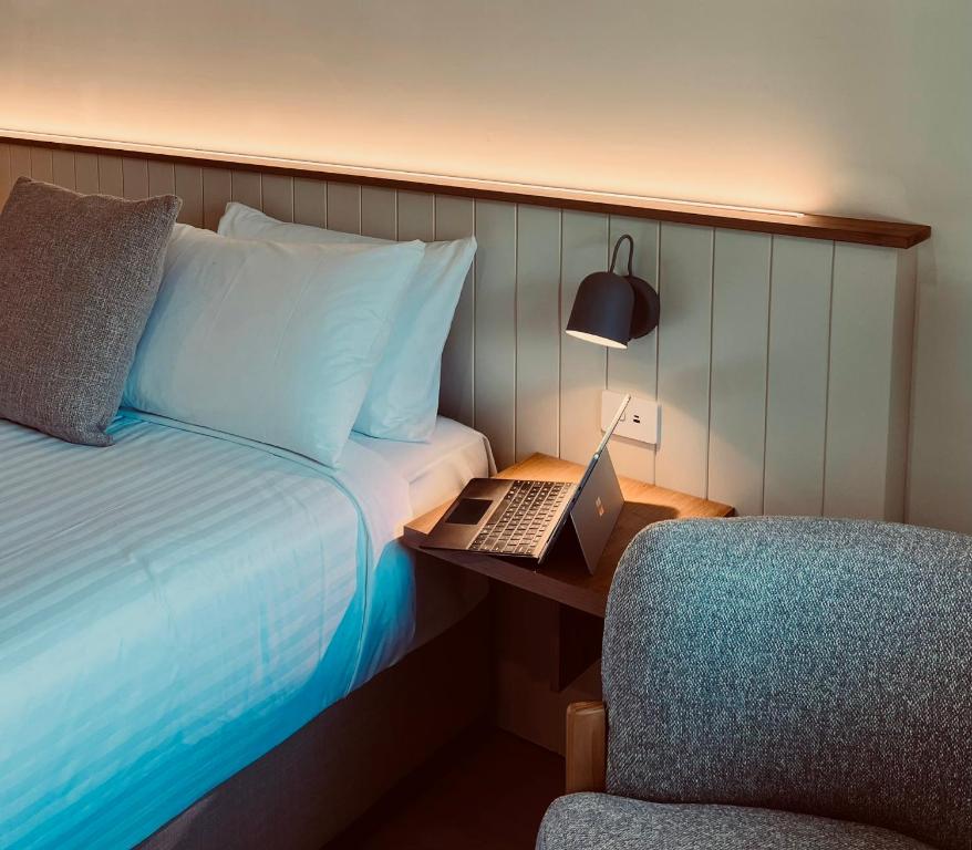 Postel nebo postele na pokoji v ubytování Lismore Gateway Motel
