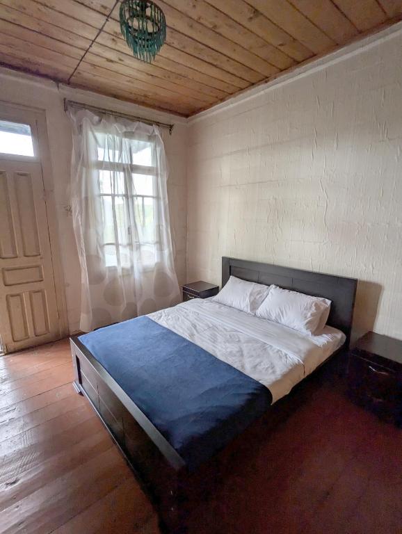 Postel nebo postele na pokoji v ubytování Tasia Guesthouse