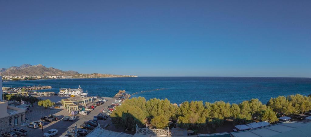an aerial view of a city and the ocean at Libyan Sea Suites in Ierápetra