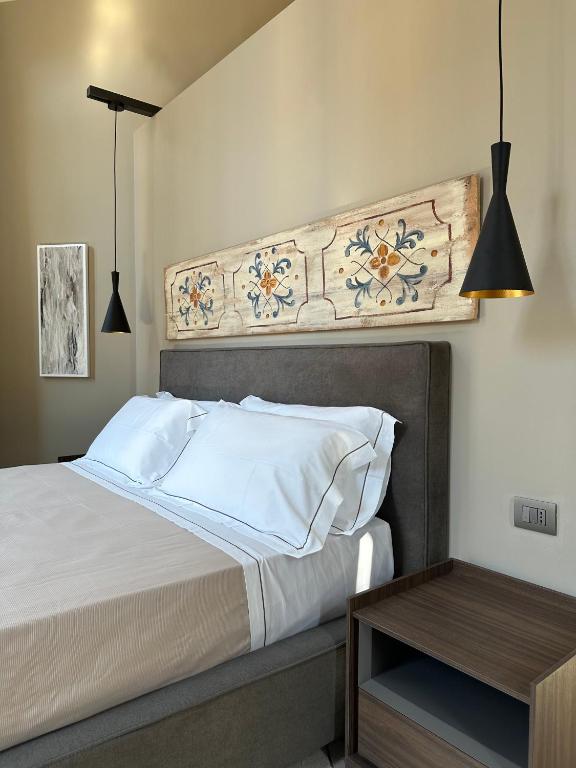 Postel nebo postele na pokoji v ubytování Palazzo Liberty Unique Hotel by Geocharme