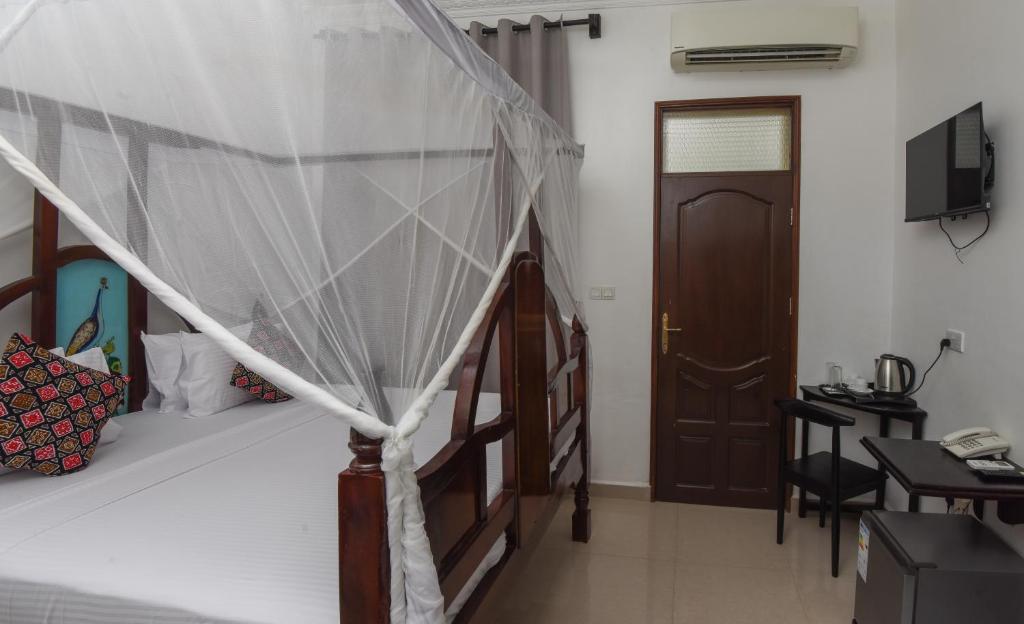 Postel nebo postele na pokoji v ubytování Zanzibar View Hotel
