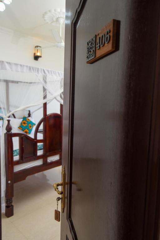 Postel nebo postele na pokoji v ubytování Zanzibar View Hotel