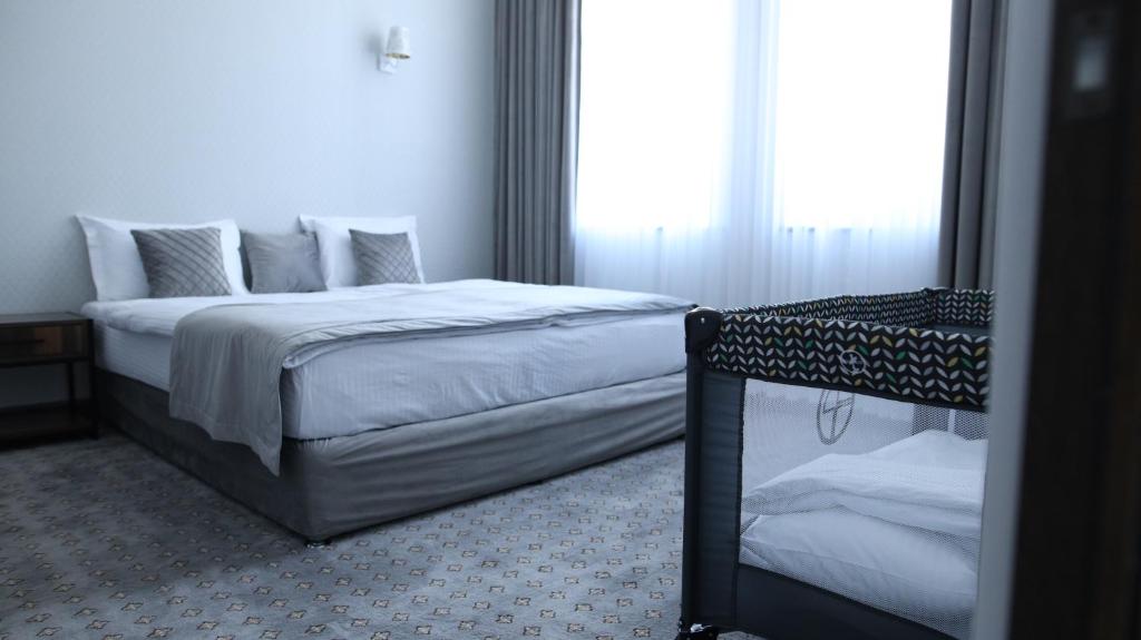 Postel nebo postele na pokoji v ubytování BMG Hotel by Grigoryans Group