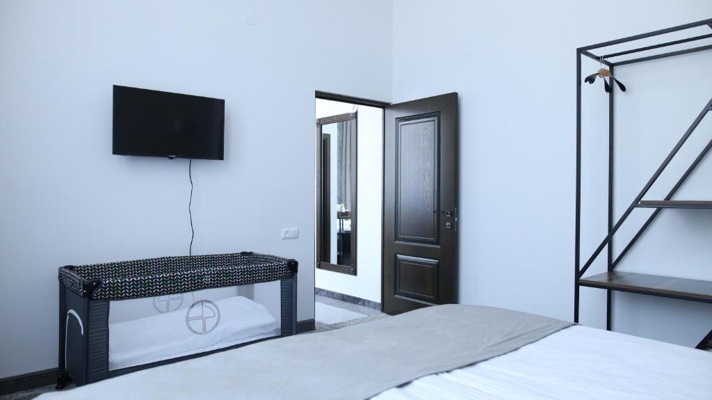 Postel nebo postele na pokoji v ubytování BMG Hotel by Grigoryans Group