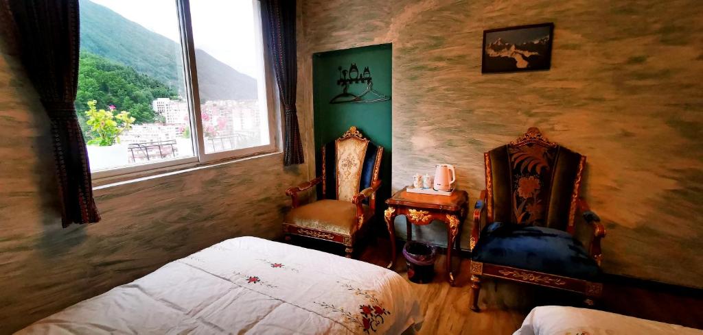 Postel nebo postele na pokoji v ubytování Kangding Guozhuang Nan Wu Hao Boutique Inn