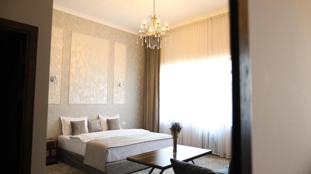 Postel nebo postele na pokoji v ubytování BMG Hotel by Grigoryans Group