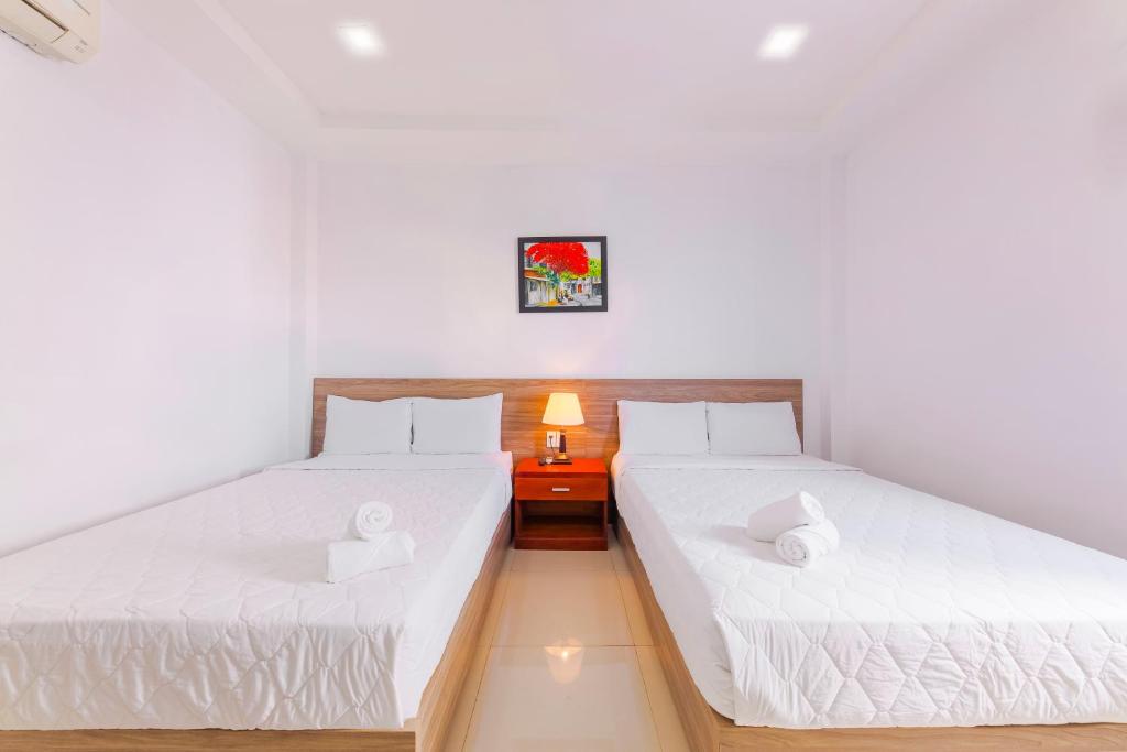 Postel nebo postele na pokoji v ubytování Mangolia Hotel