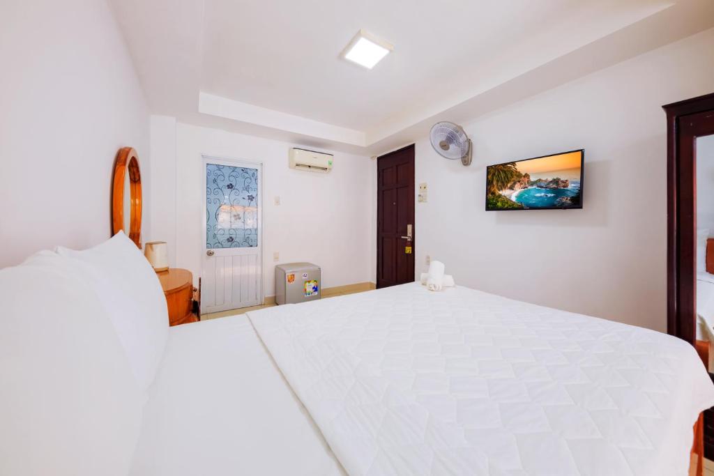 Postel nebo postele na pokoji v ubytování Mangolia Hotel