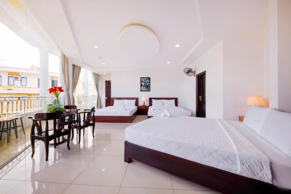 Postel nebo postele na pokoji v ubytování Mangolia Hotel