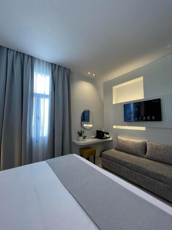 Posteľ alebo postele v izbe v ubytovaní Palladion Boutique Hotel