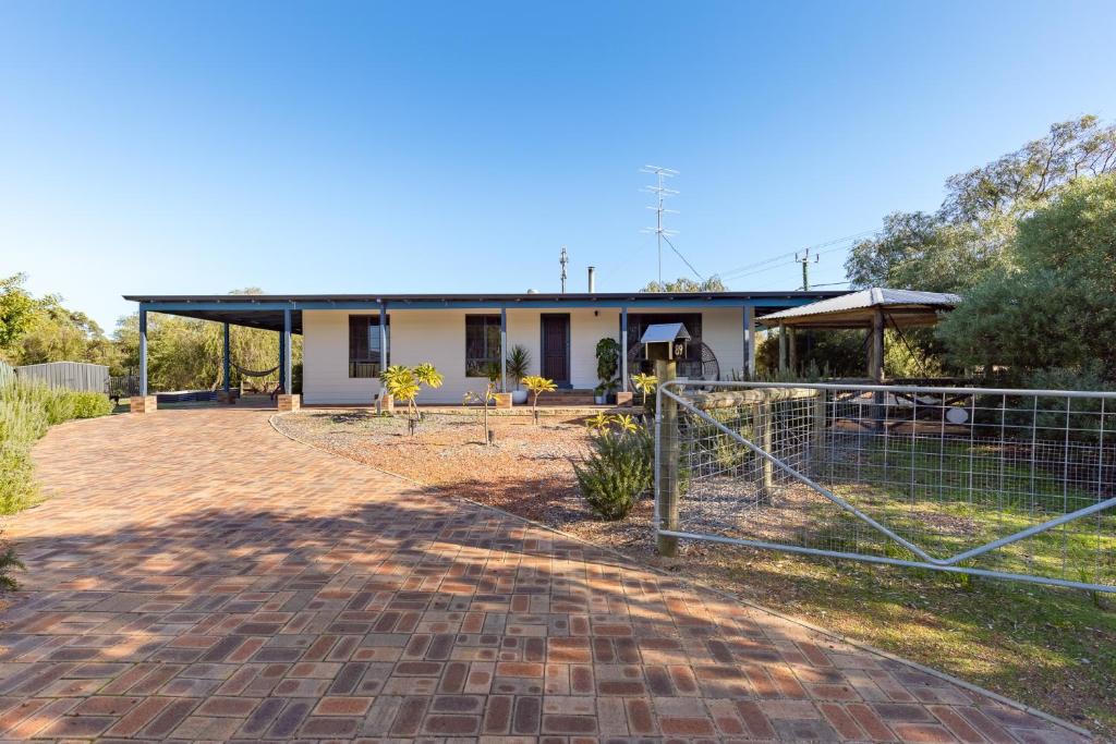a house with a fence in front of it at Roo With A View By Swan Bnb Management in Preston Beach