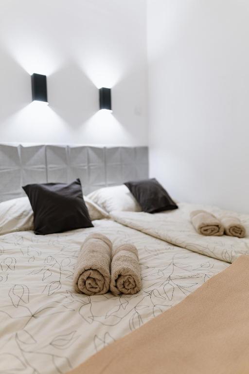 Postel nebo postele na pokoji v ubytování Vimini Apartman