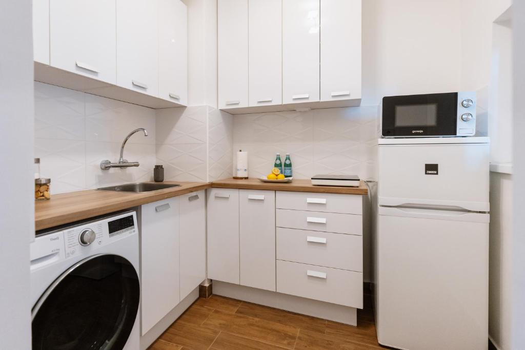Kuchyň nebo kuchyňský kout v ubytování Vimini Apartman