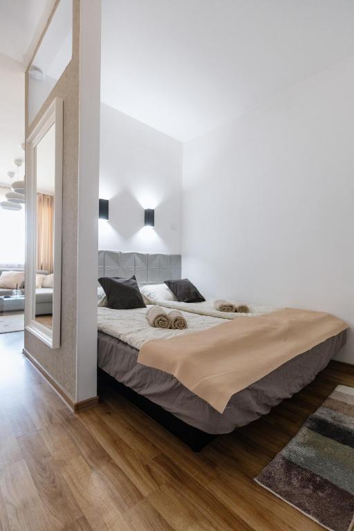 Postel nebo postele na pokoji v ubytování Vimini Apartman