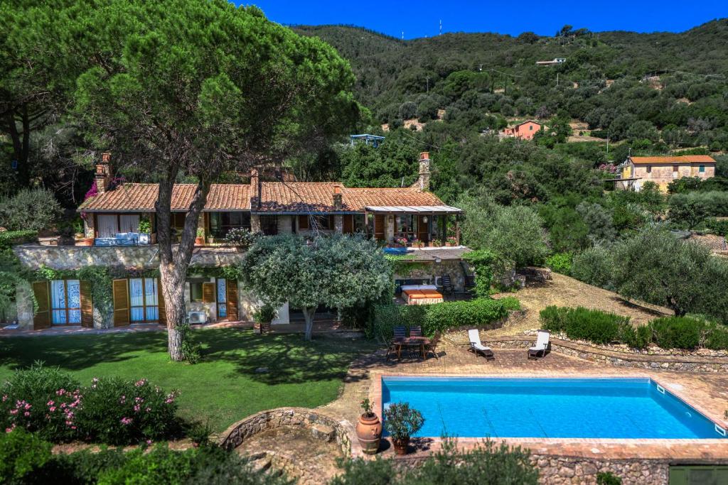 an aerial view of a house with a swimming pool at Porto Ercole Exclusive Villa in Porto Ercole