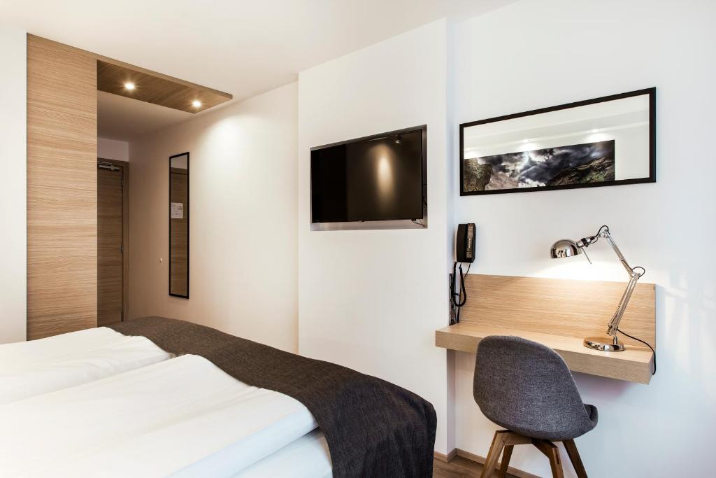 Postel nebo postele na pokoji v ubytování Storm Hotel by Keahotels