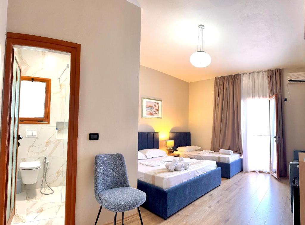 Postel nebo postele na pokoji v ubytování Hotel Denta