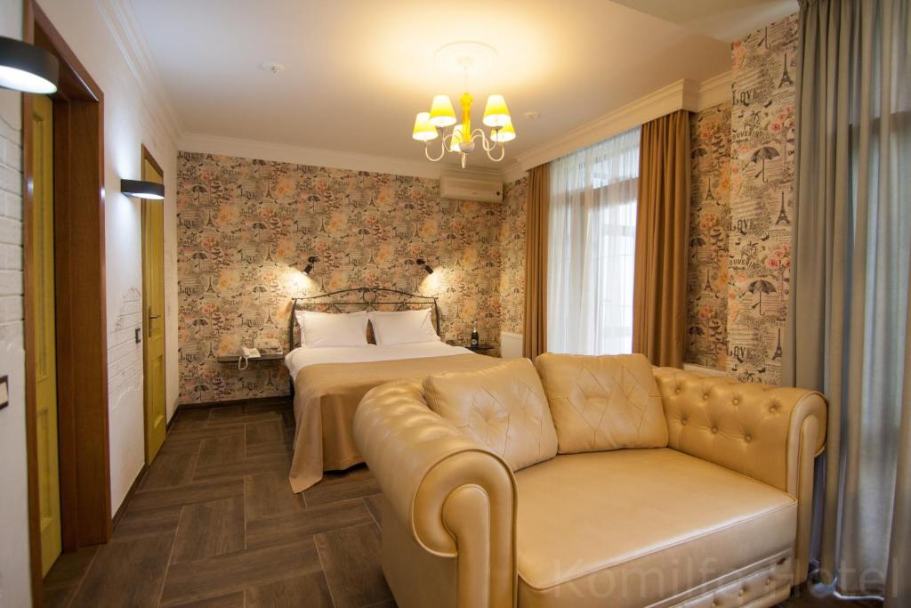Postel nebo postele na pokoji v ubytování Komilfo Hotel