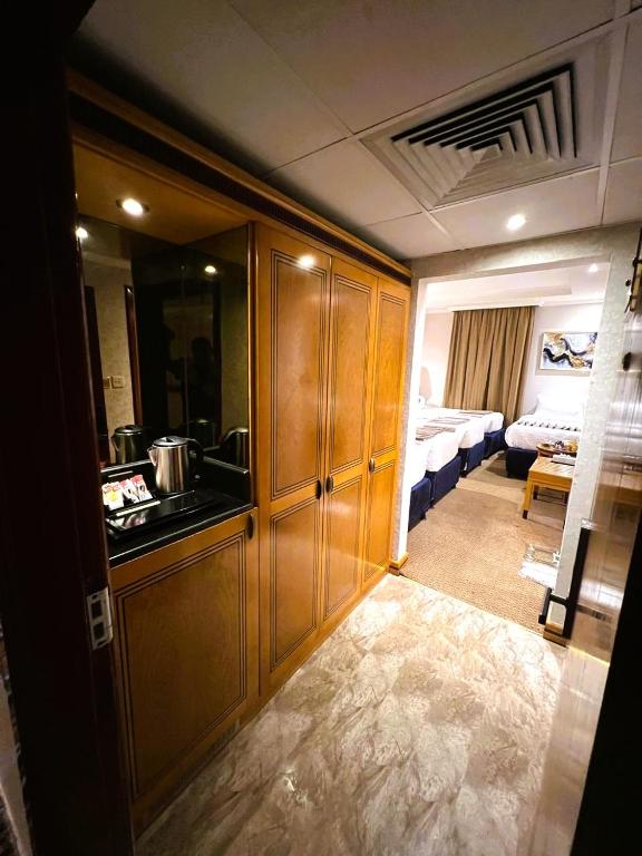 Postel nebo postele na pokoji v ubytování Maysan Al Maqam Hotel