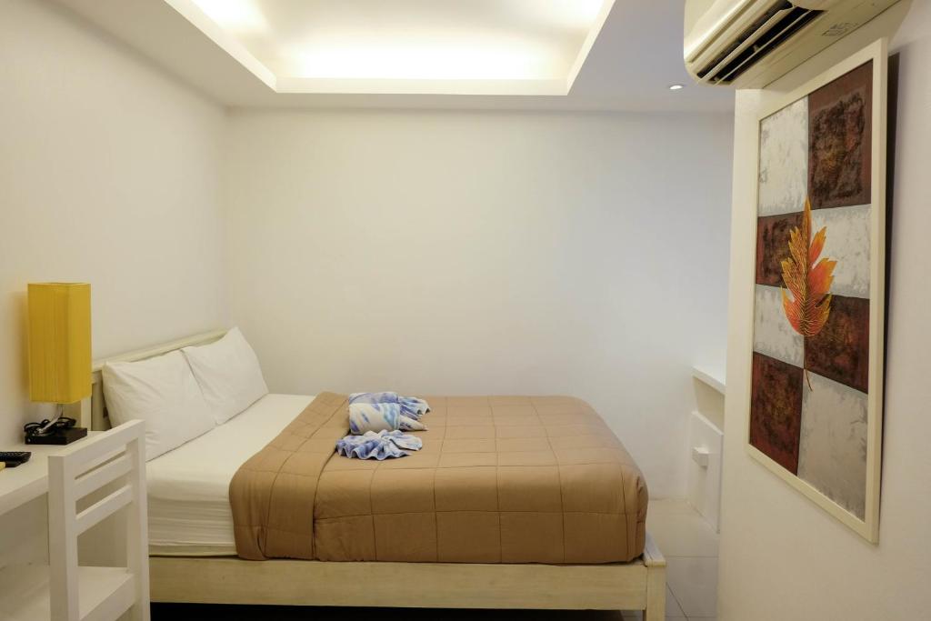 Postel nebo postele na pokoji v ubytování Baanpoon Apartment
