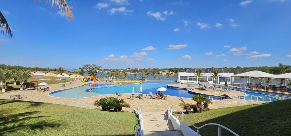 a view of a pool at a resort at Ramada by Wyndham Furnaspark in Formiga