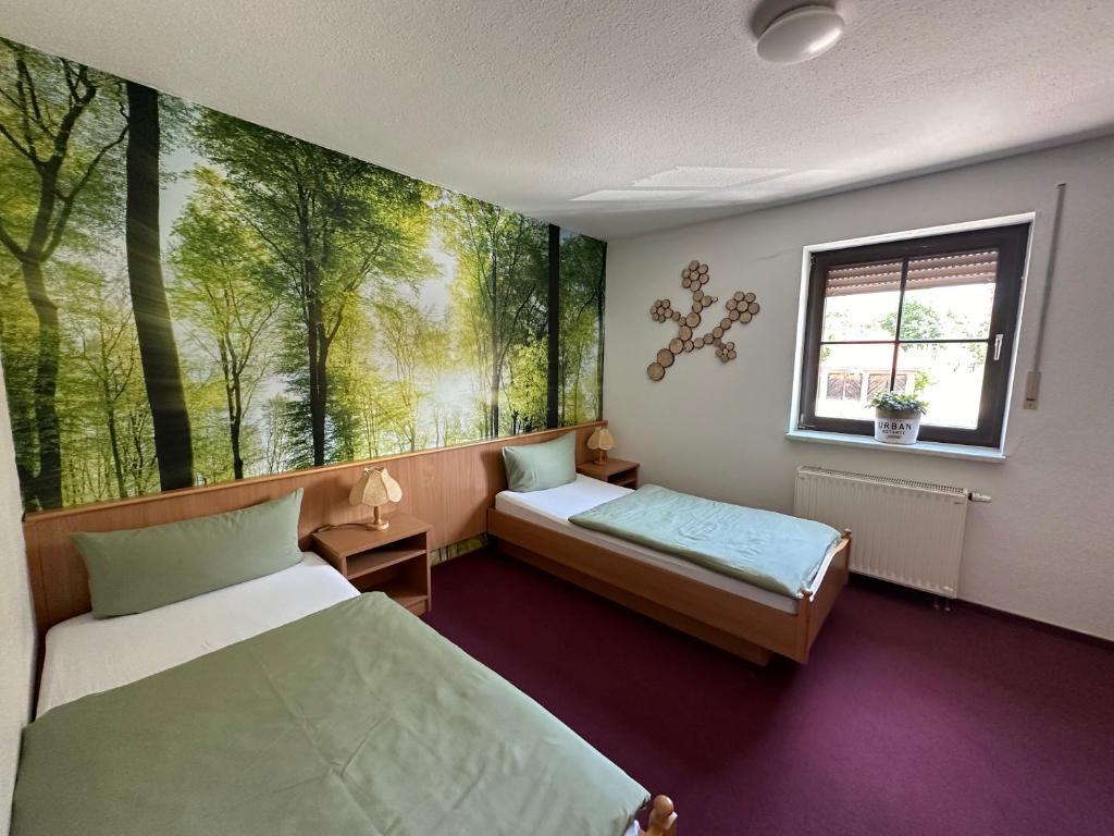 Postel nebo postele na pokoji v ubytování Pension und Monteurzimmer mit Küche und Waschmaschine