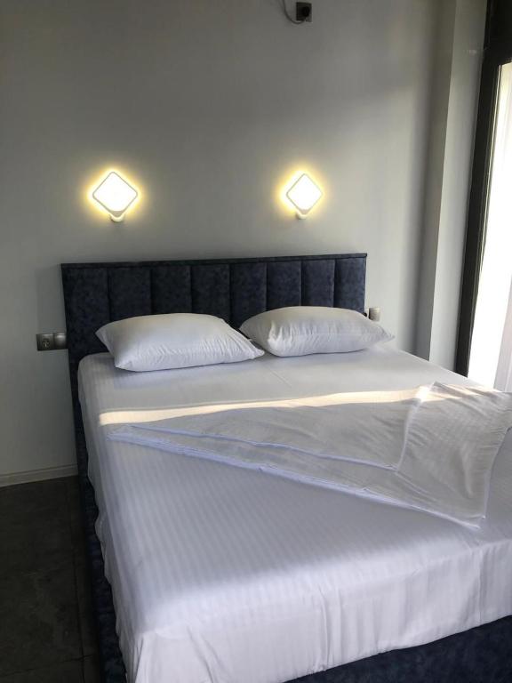 Postel nebo postele na pokoji v ubytování Blue Horizon Apartments