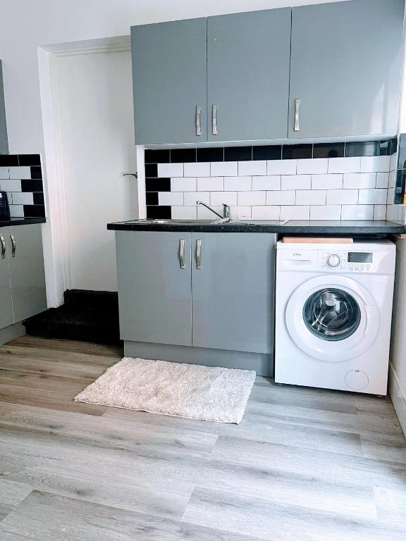 Kuchyň nebo kuchyňský kout v ubytování Bay Wind Apartment